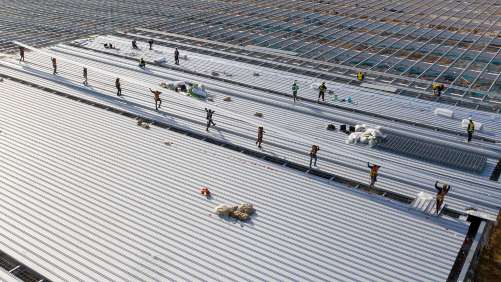 Professional-roofing-contractors-installing-a-commercial-metal-roof-1030x579.jpg